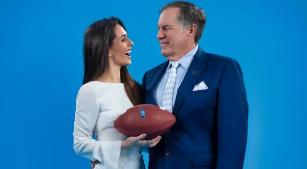 Jordon Hudson and Bill Belichick smiling at each other