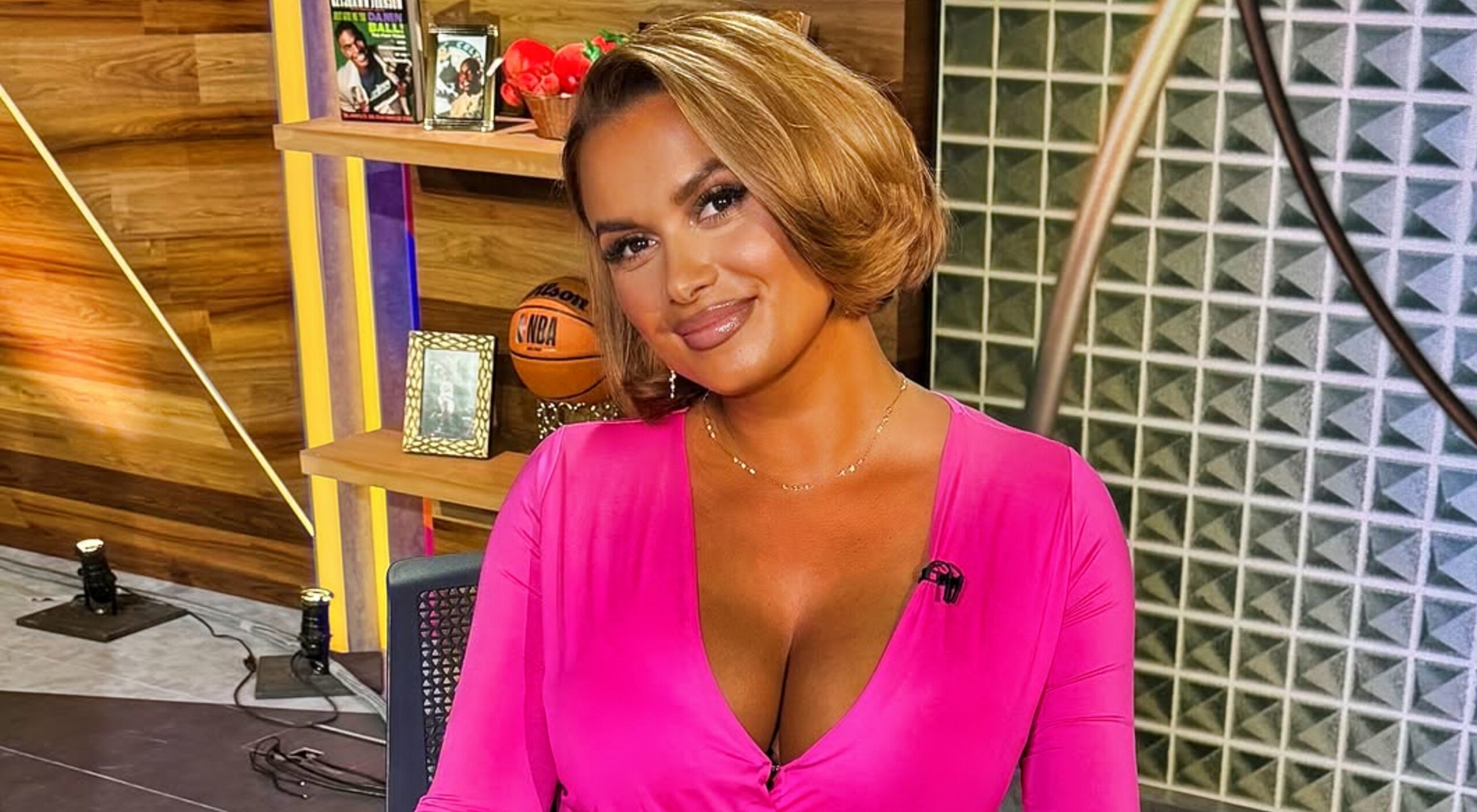 Joy Taylor posing at Fox Sports desk