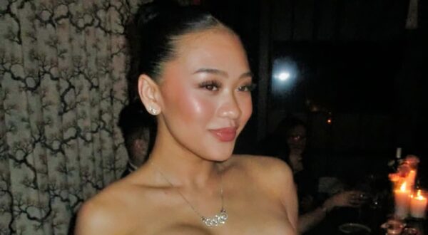 Sunisa Lee posing in dress