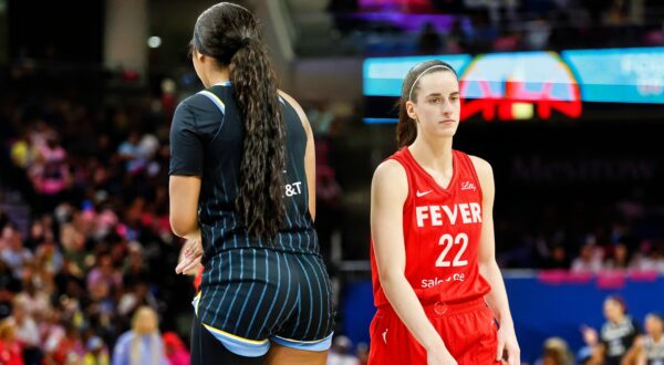 Angel Reese standing opposite Caitlin Clark