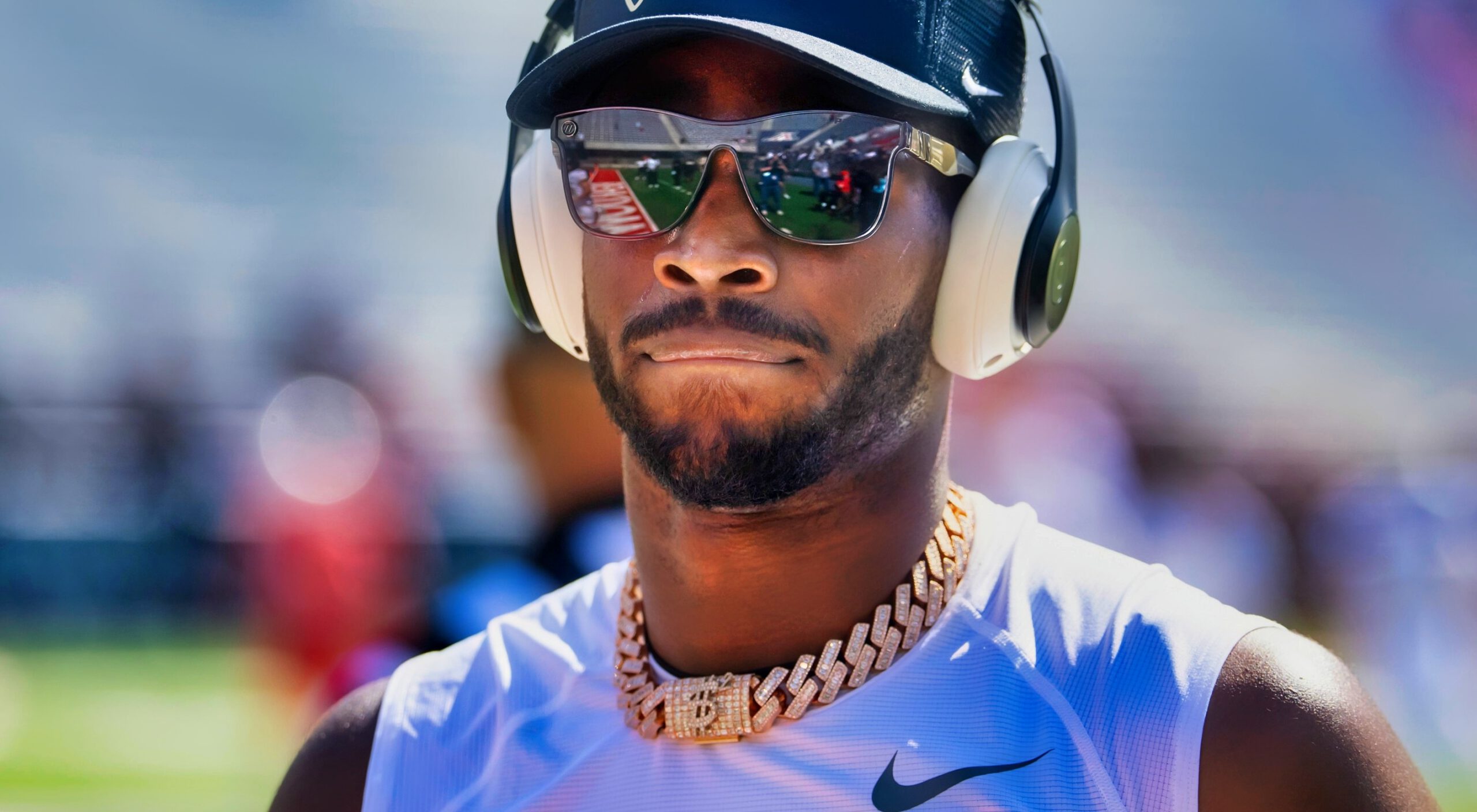 Shedeur Sanders with chain and headphones on