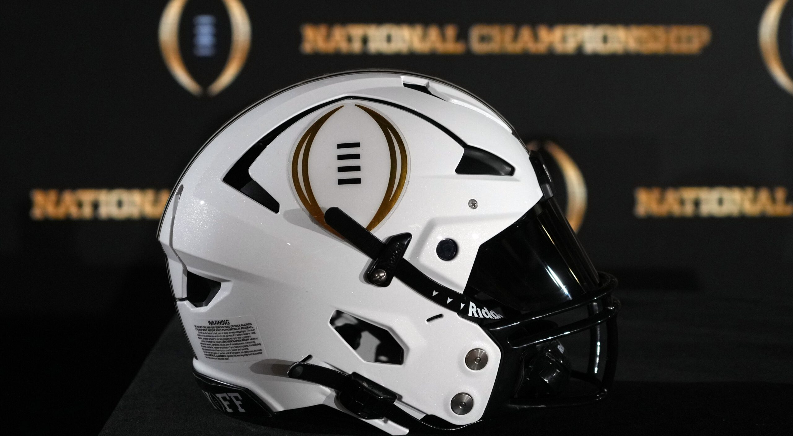 Photo of College Football Playoff logo on helmet for story on Akron Zips