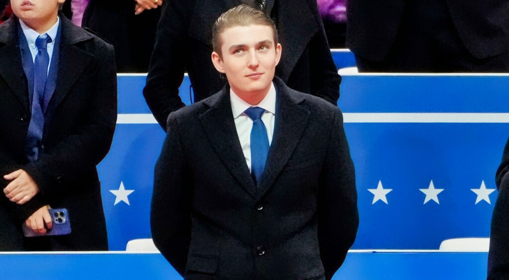 Barron Trump in black suit
