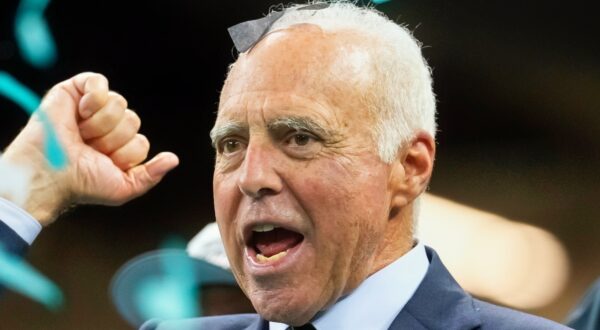 Jeffrey Lurie looking on.