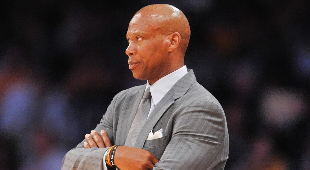 Byron Scott in suit on the court