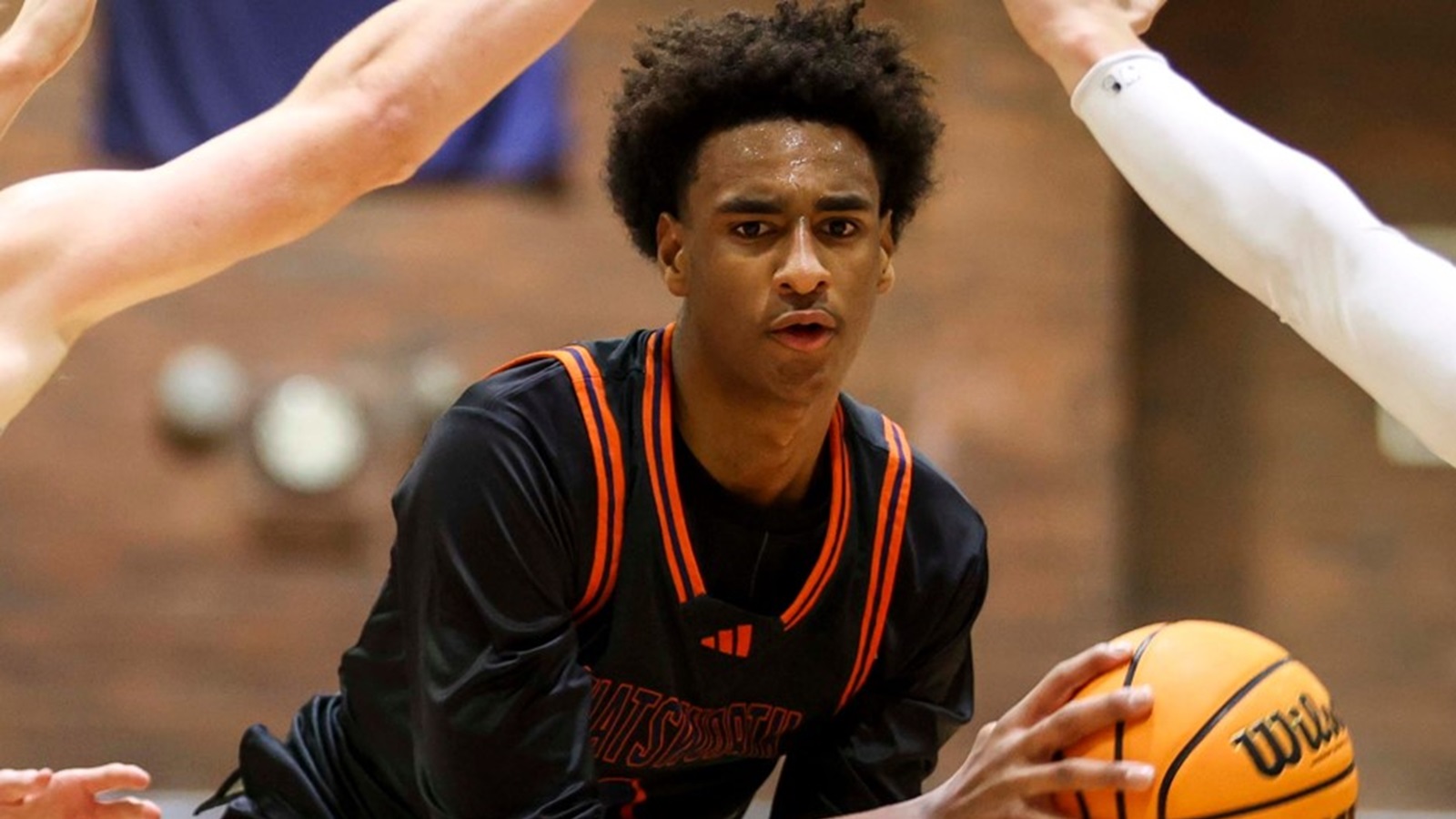 Alijah Arenas handling the basketball