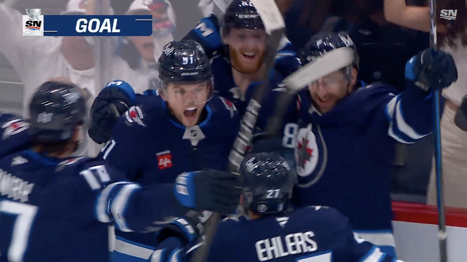Cole Perfetti celebrating his game-tying goal in Jets-Blues Game 7