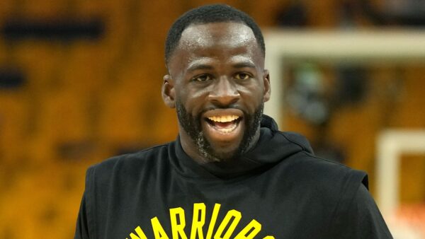 Draymond Green in a warmup shirt