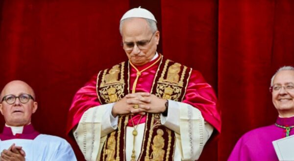 New Pope Robert F. Prevost with his head bowed