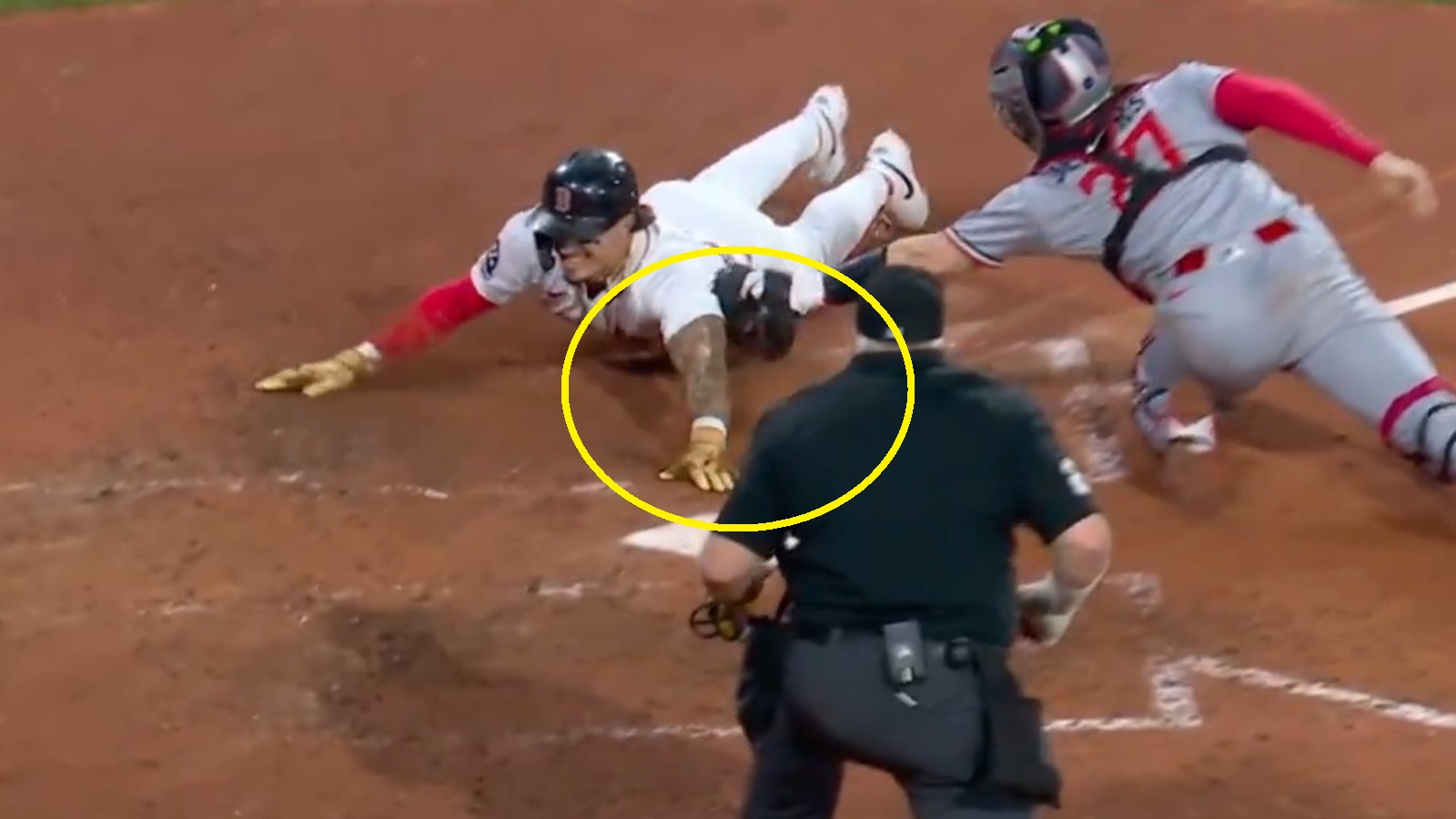 Jarren Duran sliding into home plate